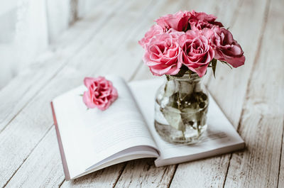 Close-up of roses in vase on table