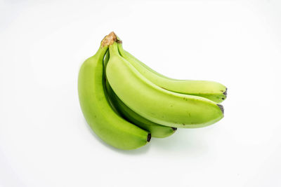 Close-up of bananas against white background