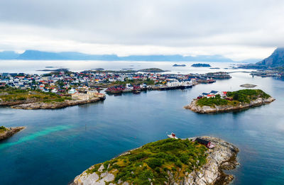 Panoramic view of sea and buildings against sky