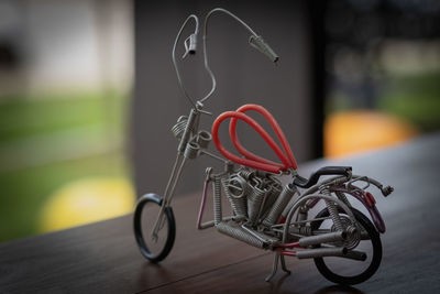 Close-up of toy bicycle on table