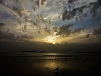 Scenic view of sea against sky at sunset