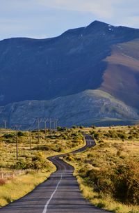 Empty road along landscape