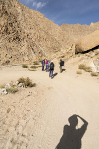 Shadow of people on desert