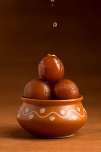 Close-up of fruits in bowl on table