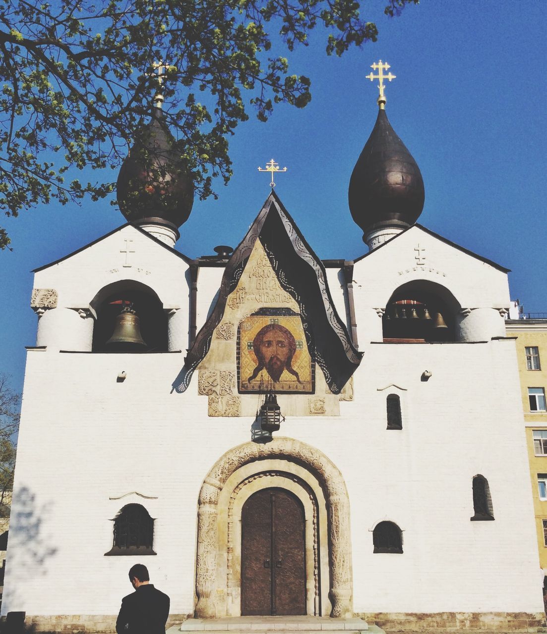 religion, place of worship, church, spirituality, building exterior, architecture, built structure, cross, cathedral, low angle view, blue, dome, sky, facade, arch, outdoors, day, bell tower