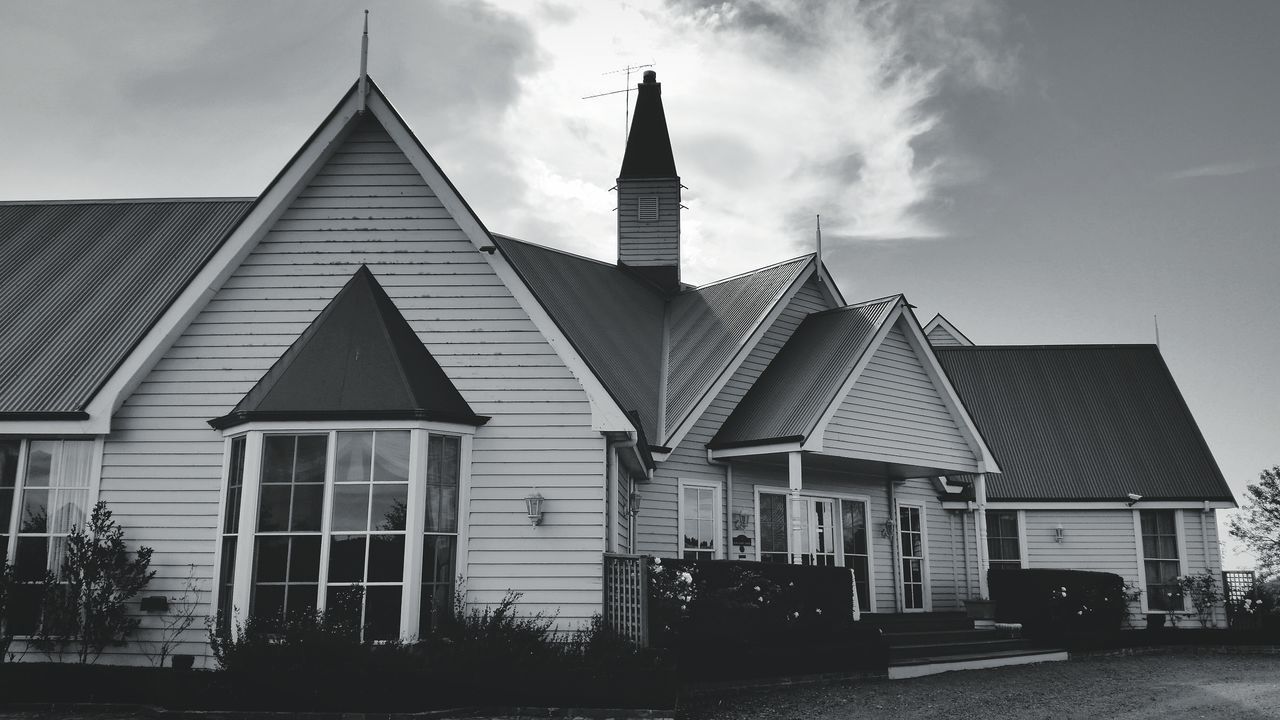 architecture, building exterior, built structure, sky, tower, low angle view, cloud - sky, city, tall - high, cloud, day, outdoors, building, no people, exterior, cloudy, travel destinations, sunlight, street, facade
