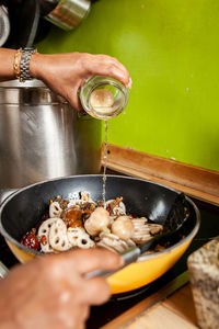  to prepare the spicy thai soup, sesame oil is poured into the pan