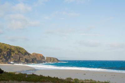 Scenic view of beach against sky