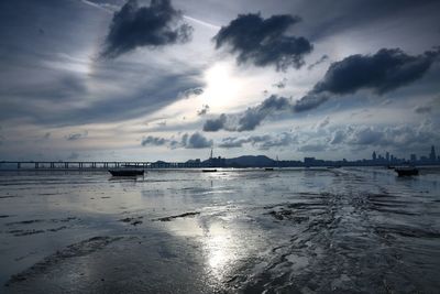 Scenic view of sea against cloudy sky