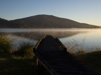 Scenic view of lake with mountains in background