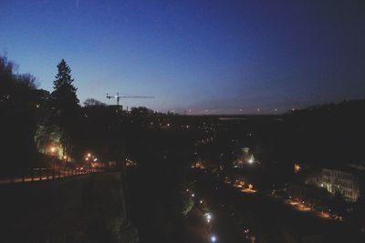 View of illuminated road at night
