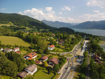 High angle view of townscape by mountains against sky