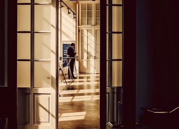 Businessman standing at doorway in office