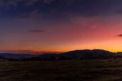 Scenic view of silhouette landscape against sky during sunset