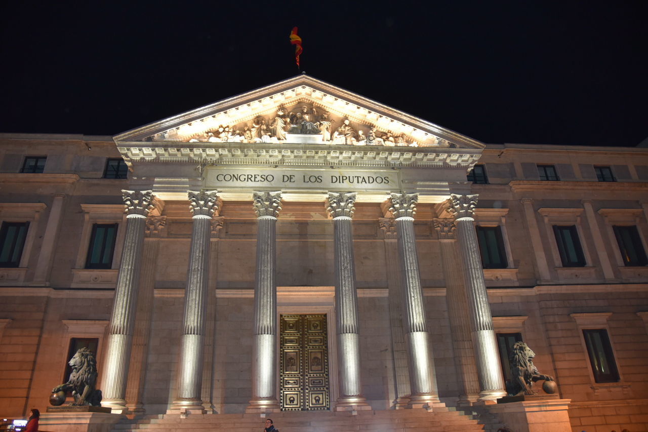 LOW ANGLE VIEW OF ILLUMINATED BUILDING