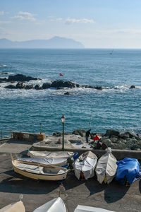 The old fishing village of boccadasse, a neighborhood of genoa, with fishing boats on the quayside