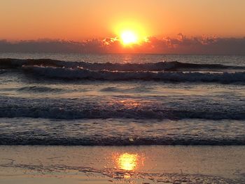 Scenic view of sea at sunset