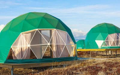 Green glamping on the pacific ocean near the volcano on kamchatka peninsula