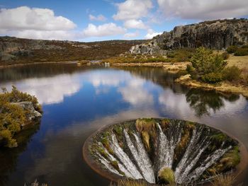 Sinkhole on lake by serra da estrela mountain range