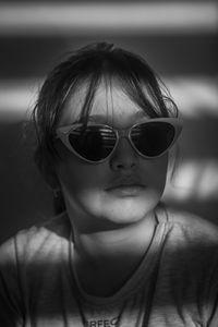 Portrait of young woman wearing sunglasses