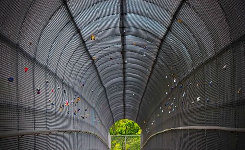 Padlocks attached to metallic archway