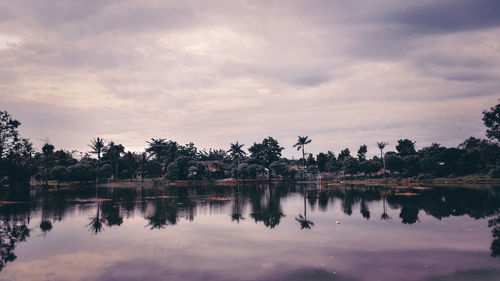Scenic view of lake against sky at sunset
