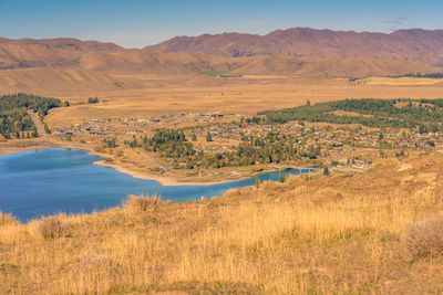 Scenic view of landscape and mountains against sky