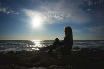 Woman sitting on beach