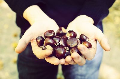 Cropped hand holding food