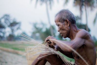 Portrait of man against blurred background