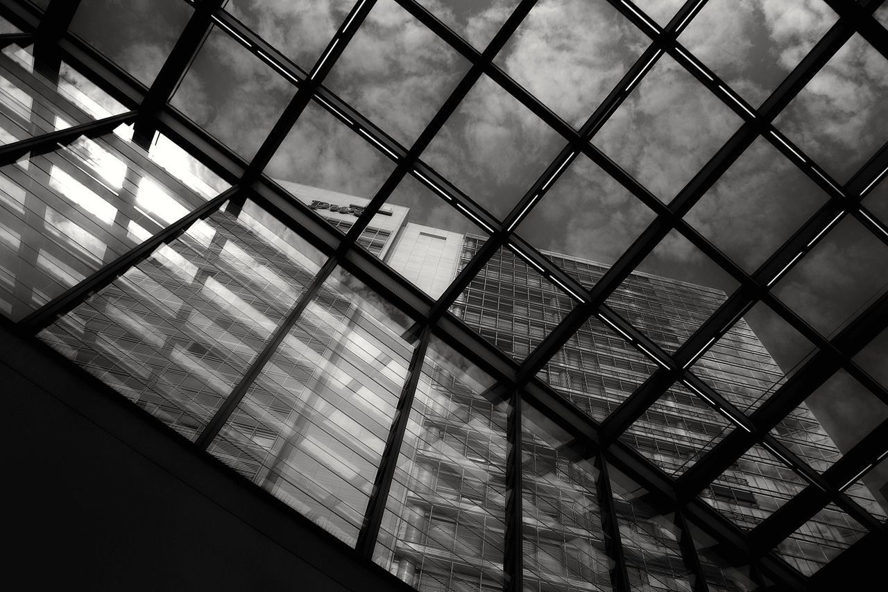 indoors, pattern, metal, full frame, built structure, backgrounds, architecture, glass - material, railing, metallic, ceiling, low angle view, chainlink fence, protection, sky, day, window, geometric shape, modern, transparent