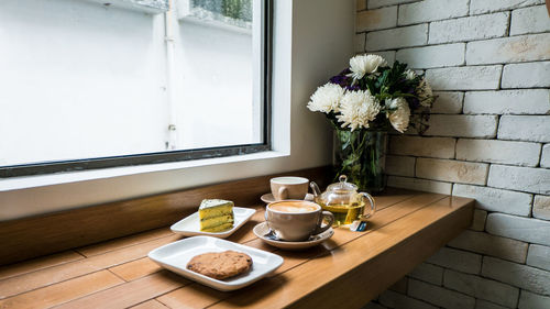Flower vase on table at home