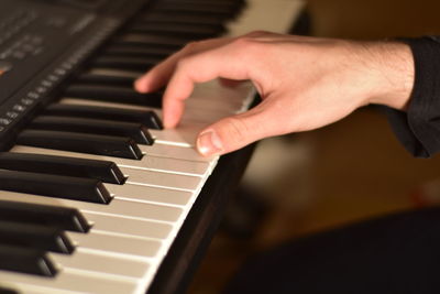 Playing piano passionately close up fingers photography