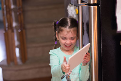 Portrait of girl with digital tablet