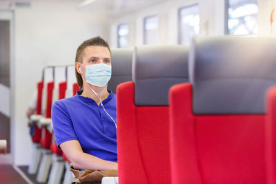 Portrait of young man sitting at home
