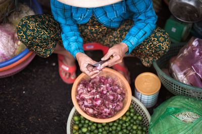 High angle view of woman having food at market