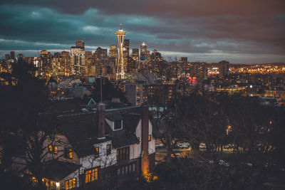 Aerial view of city lit up at night