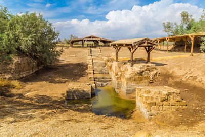 Built structure on land against sky