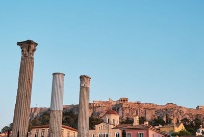 Low angle view of buildings against blue sky