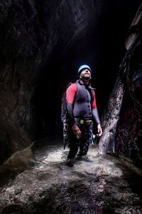 Portrait of a canyoner looking into a ray of light
