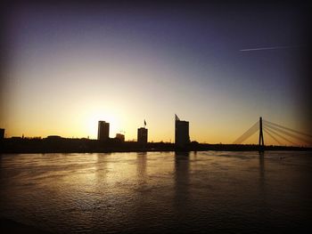 Silhouette of buildings at waterfront