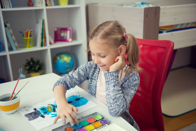 Girl painting at home