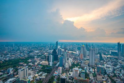 Aerial view of modern buildings in city against sky