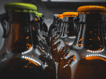 Close-up of wine bottles on table