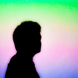 Close-up of silhouette man against blurred background