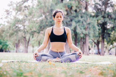 Woman meditating at park