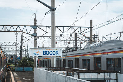 Train on railroad station against sky