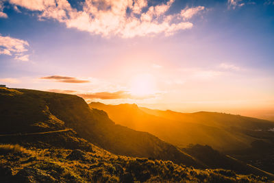 Scenic view of mountains against sky during sunset