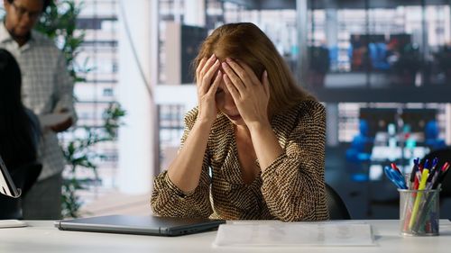 Young woman using mobile phone in cafe