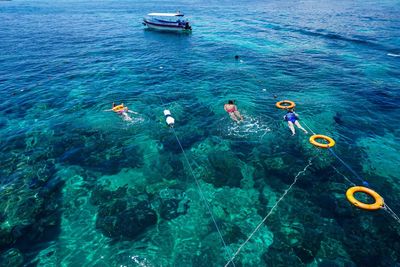 People swimming at the sea